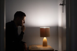 man sitting at the dark room