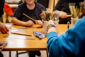 Peer support Group seating in one table doing craft
