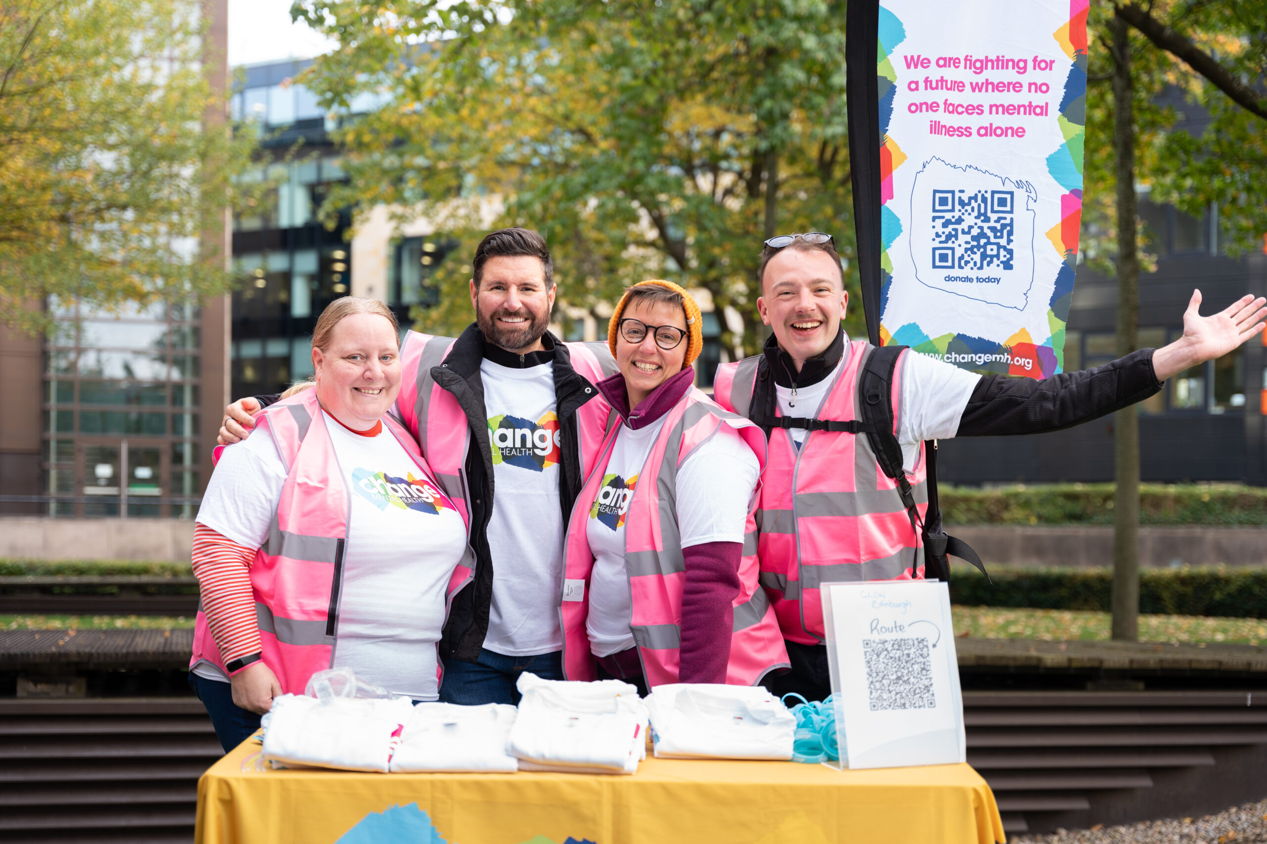 Volunteers Week - 4 people standing in Change Mental Health T-shirts at the event stand