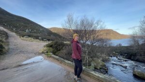 weather and mental health, women on a bridge in a winter mountain landscape