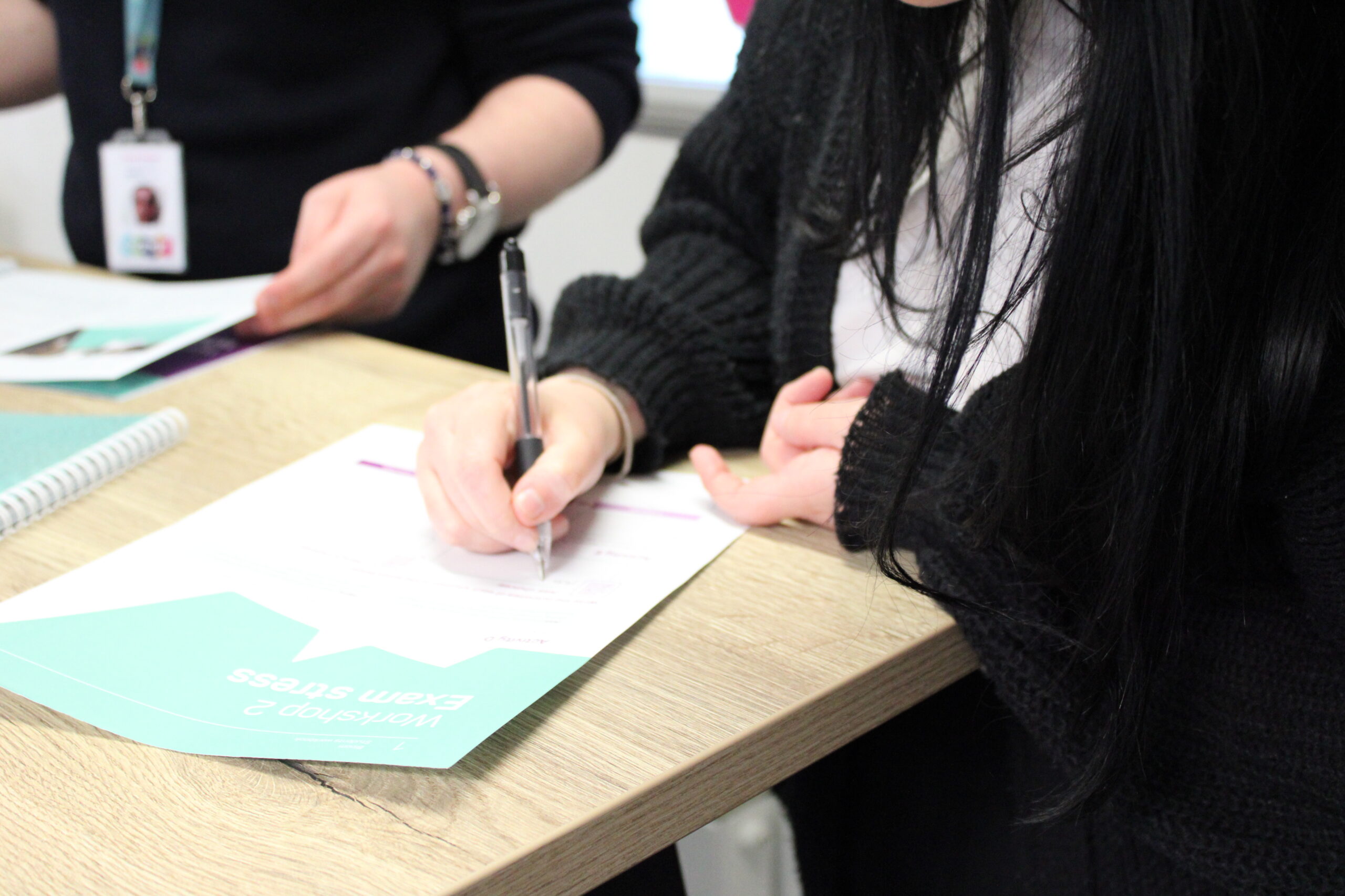 A women writing during Me&Money workshop