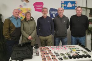 group of people standing with Change Mental Health promotional materials