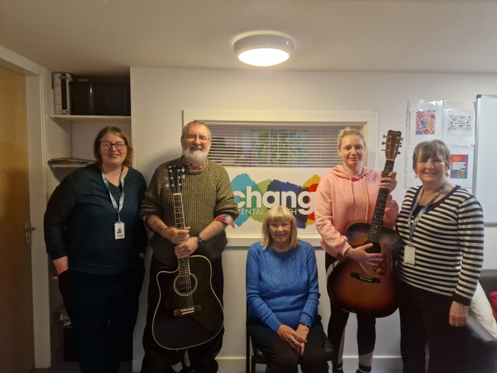 Alan with the resource centre staff and some of the music group members