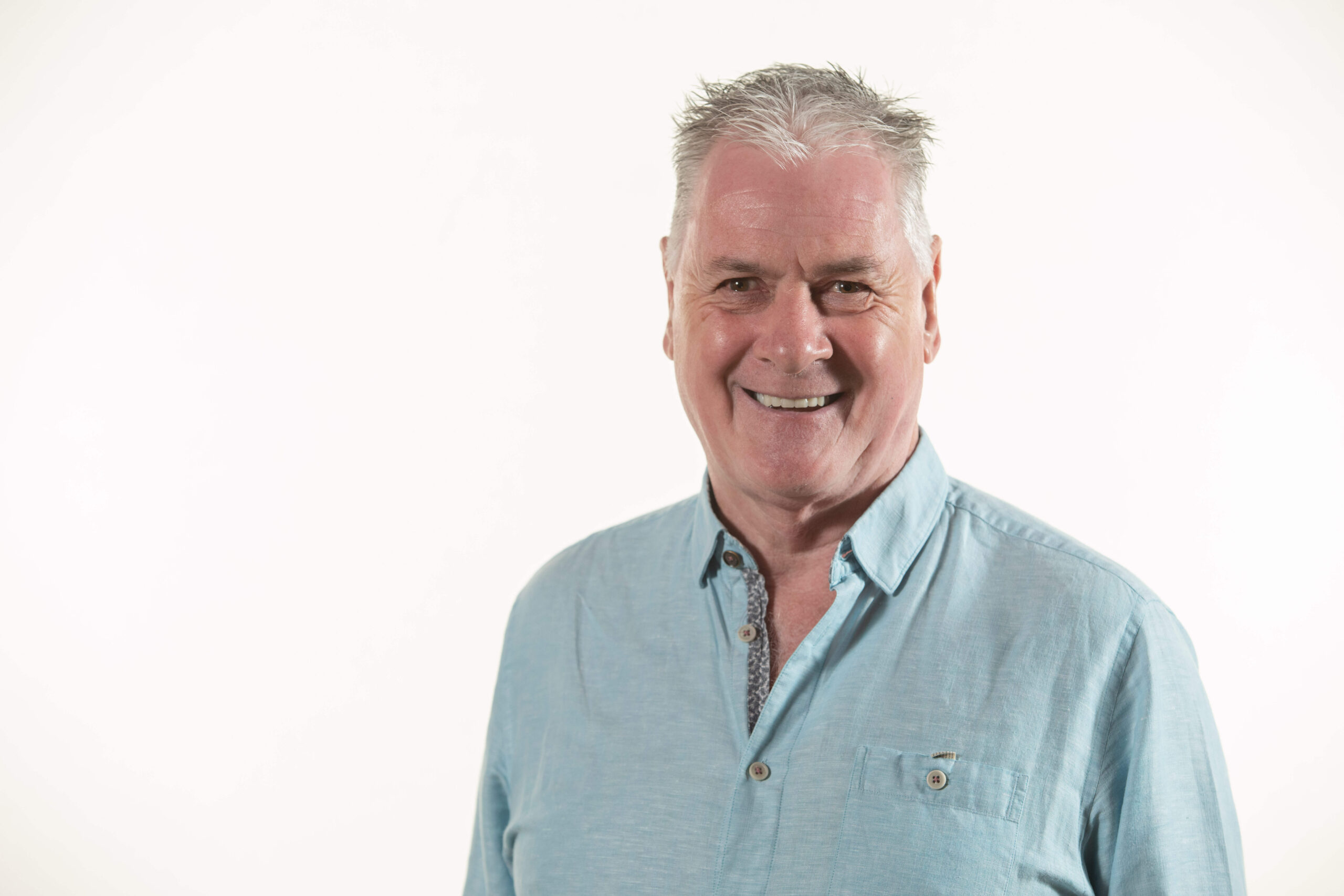 A photo of a man, Alan Clarke, smiling