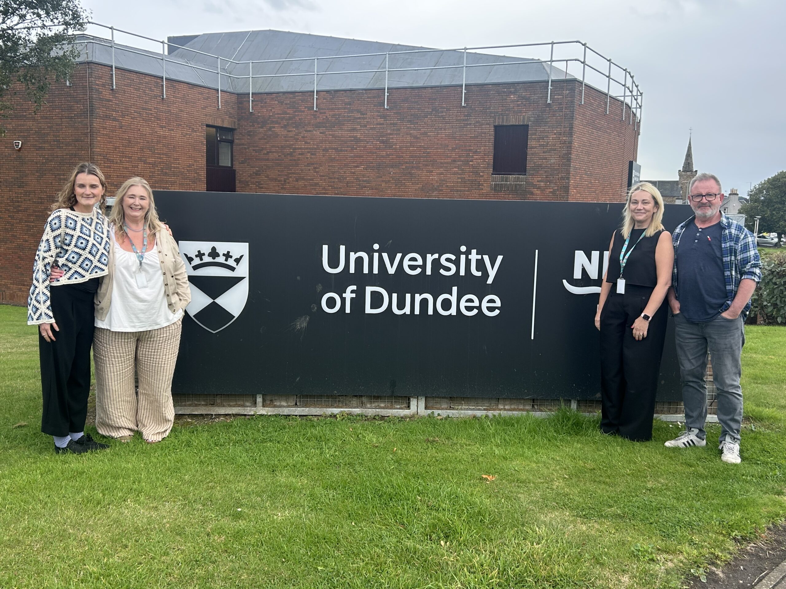 Change Mental Health's Hearing Voices team with lecturers of mental health nursing at the University of Dundee in front of Kirkcaldy campus